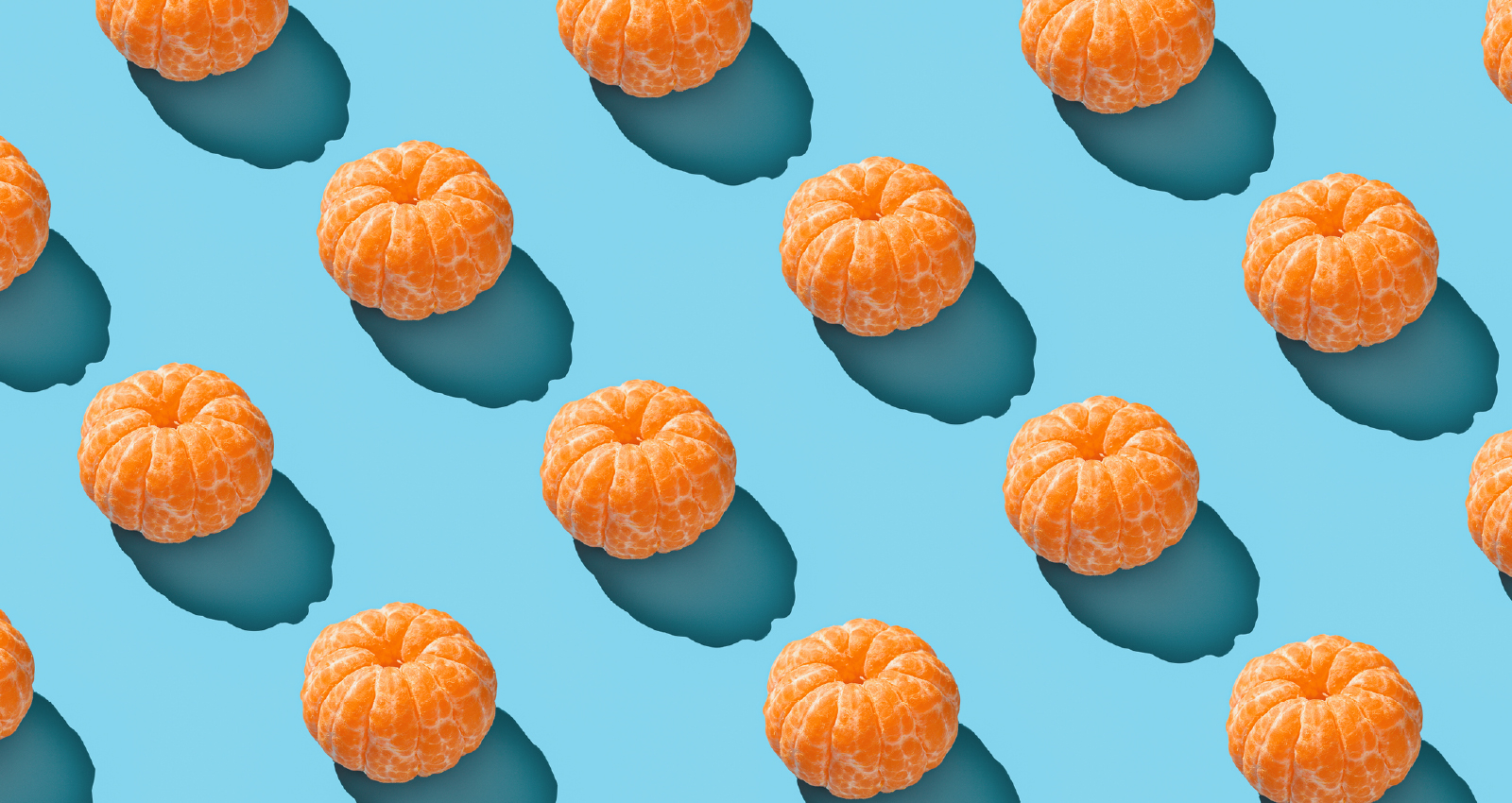 Image of peeled clementine grid on blue background