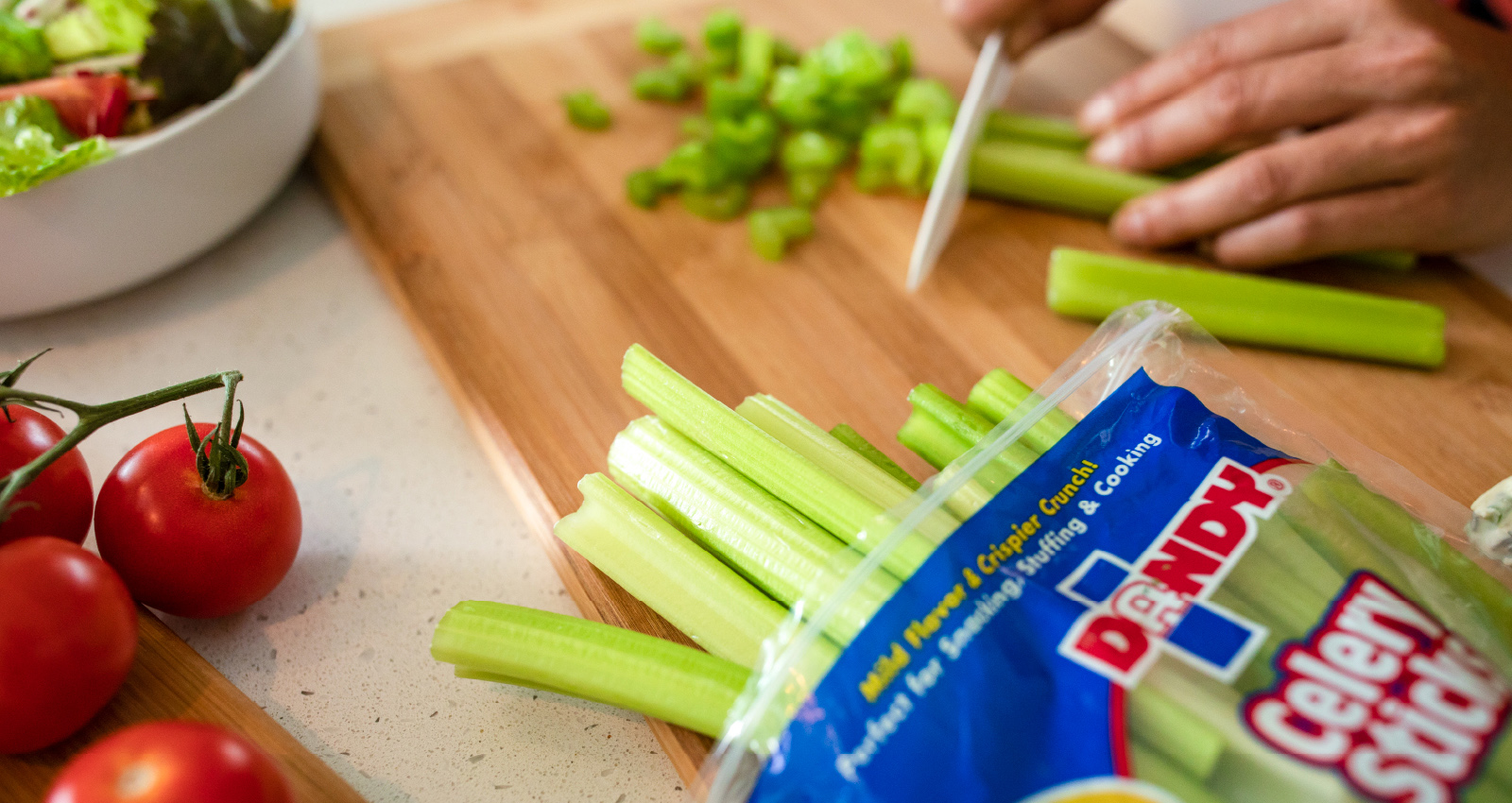 Image of person chopping Dandy celery sticks