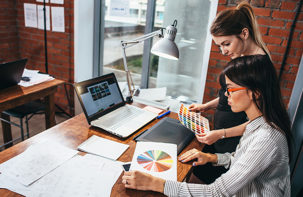 Women reviewing color swatches for brand identity