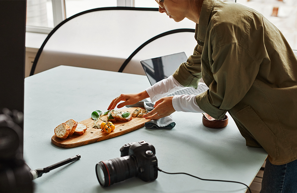 Woman setting up product for photoshoot