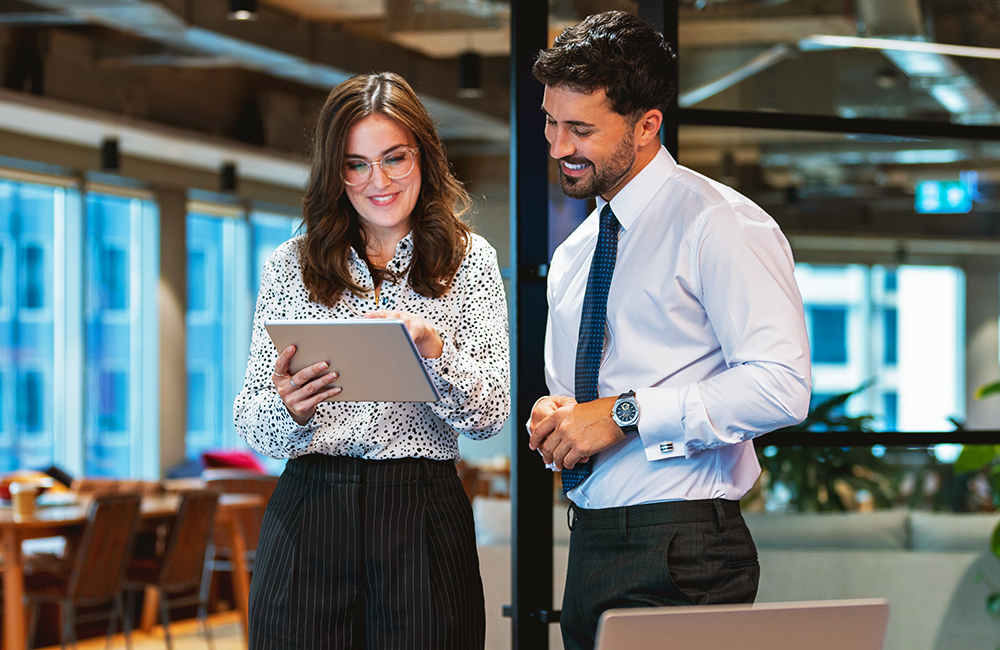 Man and woman reviewing advertising options